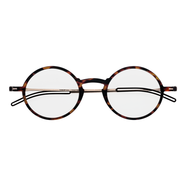 Tortoiseshell round eyeglasses with thin silver frames showcase a classic style.