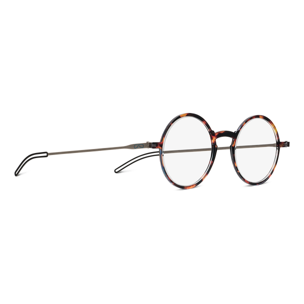 Tortoiseshell round frame eyeglasses with thin silver arms lie on a flat surface.