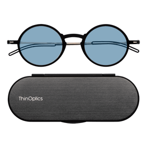 ThinOptics Black framed Reading Glasses with Blue Light Blockers and a sleek black case: minimalist design with thin lenses. The compact, brushed metal case offers a modern, portable solution for individuals needing reading glasses.