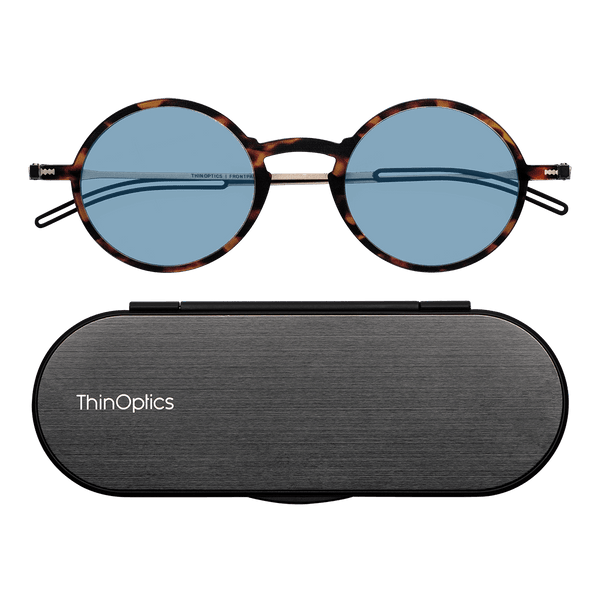 ThinOptics Tortoise framed Reading Glasses with Blue Light Blockers and a sleek black case: minimalist design with thin lenses. The compact, brushed metal case offers a modern, portable solution for individuals needing reading glasses.