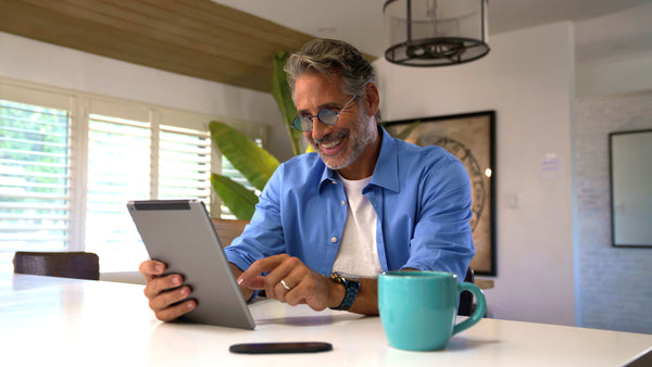 ThinOptics Black framed Reading Glasses with Blue Light Blockers and a sleek black case: minimalist design with thin lenses. The compact, brushed metal case offers a modern, portable solution for individuals needing reading glasses.