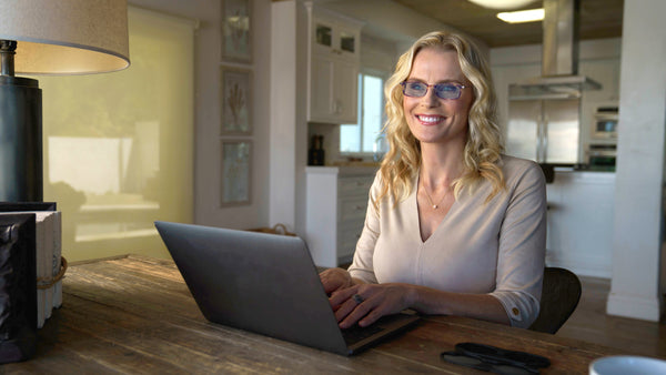 ThinOptics Black Reading Glasses with Blue Light Blockers and a sleek black case: minimalist design with thin lenses. The compact, brushed metal case offers a modern, portable solution for individuals needing reading glasses.