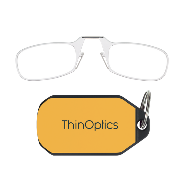 ThinOptics clear armless reading glasses above a yellow keychain case