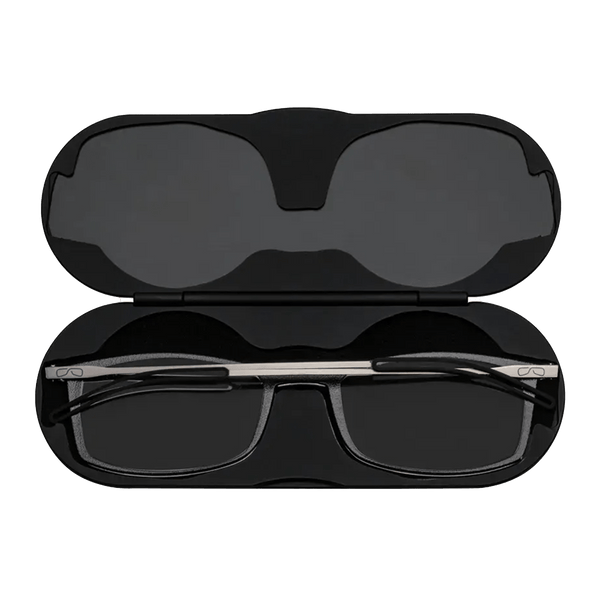 Black reading glasses nest in an open black hard-shell case.