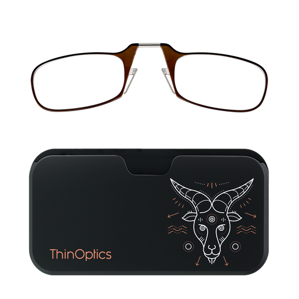 ThinOptics brown reading glasses folded in their slim black case with a white geometric goat design.