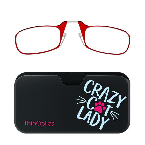 Red reading glasses rest above a black "Crazy Cat Lady" carrying case by ThinOptics.