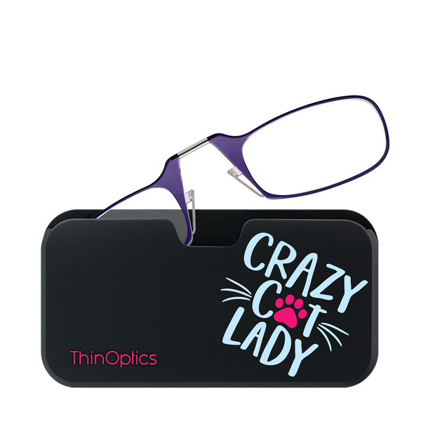 Purple ThinOptics reading glasses rest on their compact black case, adorned with a fun "Crazy Cat Lady" design and pink paw print.