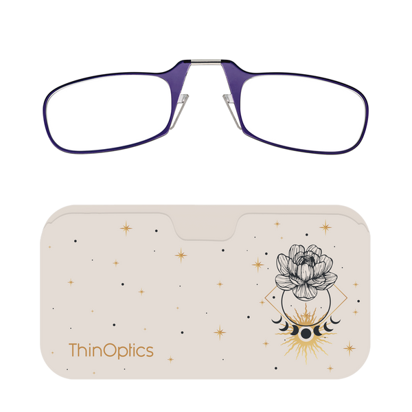 Purple ThinOptics reading glasses rest unfolded on their celestial-themed carrying case.