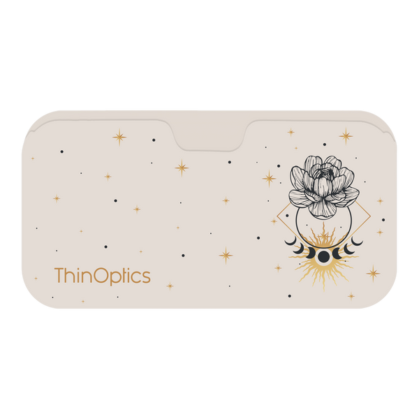 ThinOptics case decorated with a celestial design of a blooming flower, stars, moons, and a shining sun.