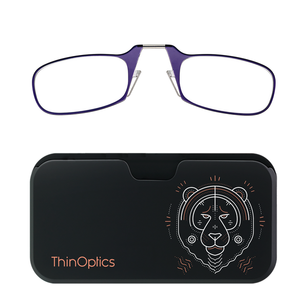 Purple ThinOptics reading glasses rest unfolded above their compact black carrying case featuring a stylized tiger design.