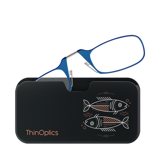 Blue ThinOptics reading glasses rest unfolded on their sleek black carrying case decorated with a copper fish design.