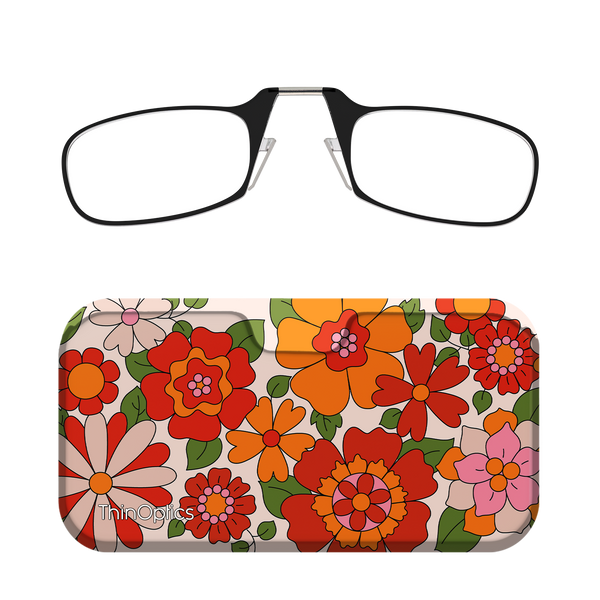 Black ThinOptics reading glasses rest unfolded above a matching floral glasses case featuring a bold orange, red, and pink floral pattern on a cream background.