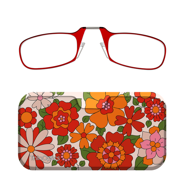 Red reading glasses with a slim, foldable design rest above a matching floral case featuring a bold orange, red, and pink flower pattern.