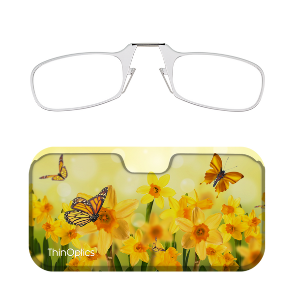 Silver ThinOptics reading glasses folded in their daffodil and butterfly-patterned case.