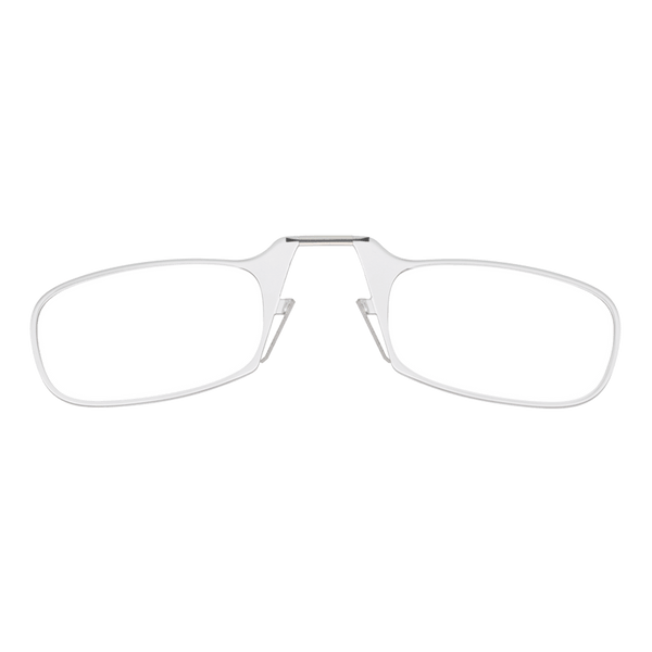 A pair of silver reading glasses with clear lenses lay open against a black background.