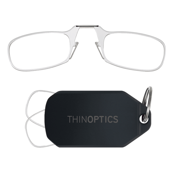 ThinOptics reading glasses with silver bridge folded and attached to black keychain case.