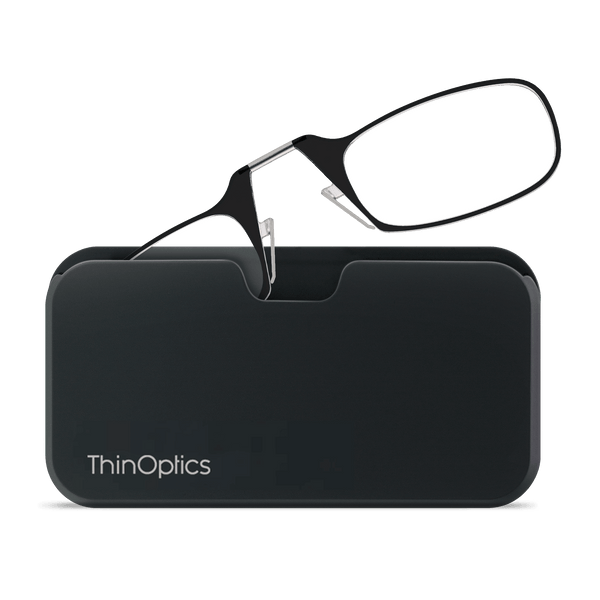 A pair of ThinOptics reading glasses rests unfolded atop its sleek, black carrying case.