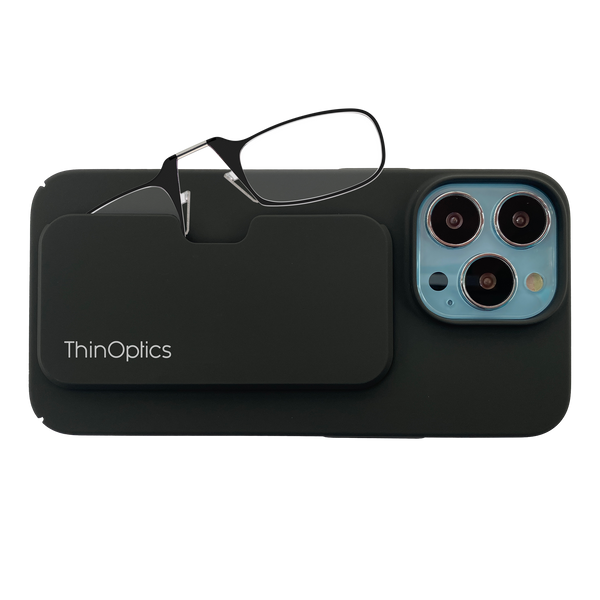 Black ThinOptics reading glasses rest on a matching phone case attached to a smartphone.
