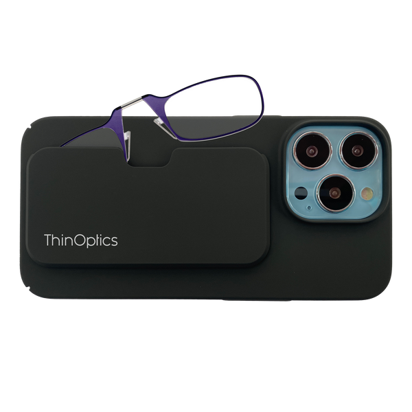 A pair of ThinOptics reading glasses rests on a sleek black phone case, highlighting the product's portability and convenience.