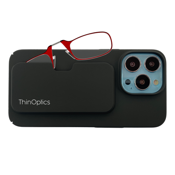 ThinOptics red reading glasses rest on a black phone case attached to a smartphone.