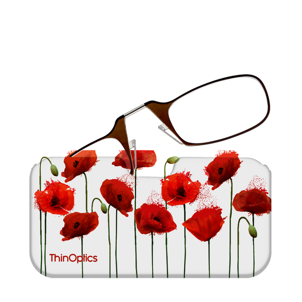 Brown ThinOptics reading glasses folded atop a white case featuring a design of vibrant red poppies.
