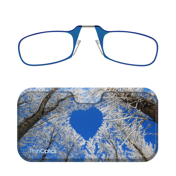 Blue ThinOptics reading glasses folded in their winter scene case.