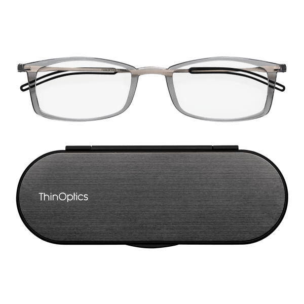 ThinOptics reading glasses and a sleek black case: minimalist design with thin lenses. The compact, brushed metal case offers a modern, portable solution for individuals needing reading glasses.