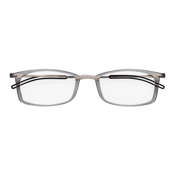 Clear, rectangular eyeglasses with thin silver frames rest on a teal background.