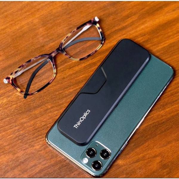 ThinOptics Tortoise Frame Connect Reading Glasses and a sleek black Connect case: minimalist design with thin lenses. The compact, polycarbonate case offers a modern, portable solution for individuals needing reading glasses.