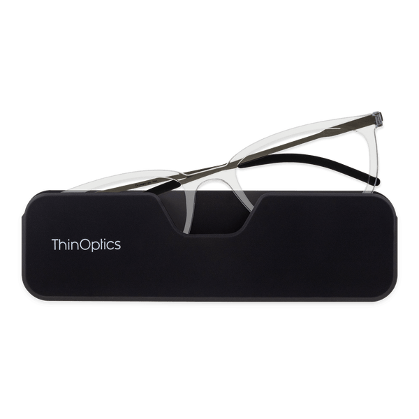 ThinOptics Clear Frame Connect Reading Glasses and a sleek black Connect case: minimalist design with thin lenses. The compact, polycarbonate case offers a modern, portable solution for individuals needing reading glasses.
