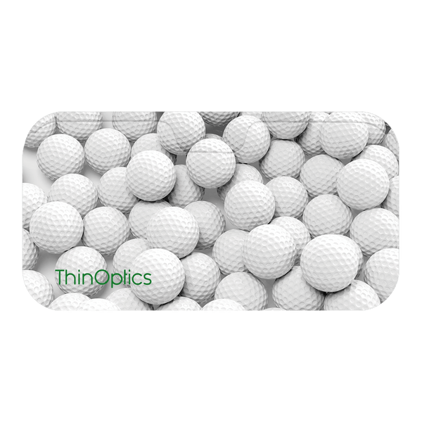 ThinOptics logo displayed on a surface covered with white golf balls.