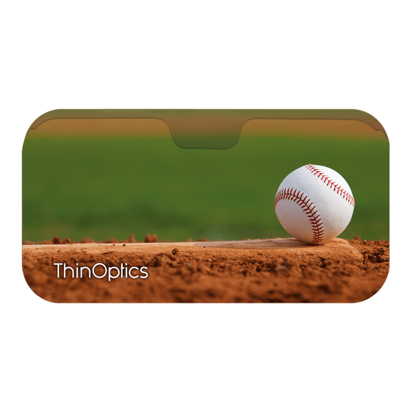 A baseball rests on a sun-baked pitcher's mound, ready for the next play. ThinOptics logo displayed.
