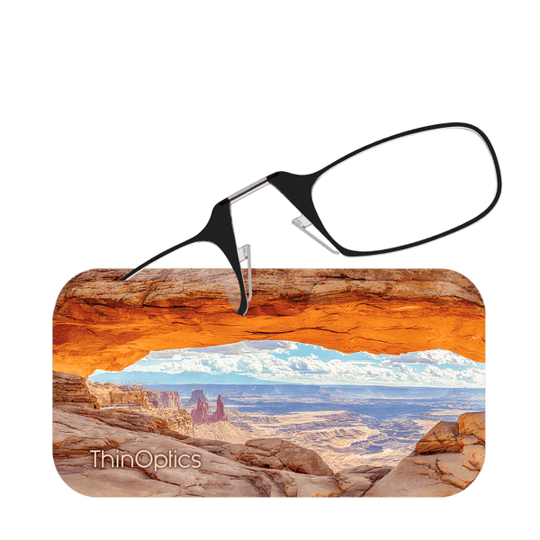 ThinOptics reading glasses rest on a scenic photo of Canyonlands National Park.