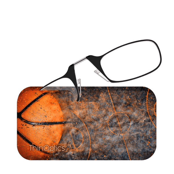 Black reading glasses rest on a ThinOptics case featuring a close-up image of a basketball and court.