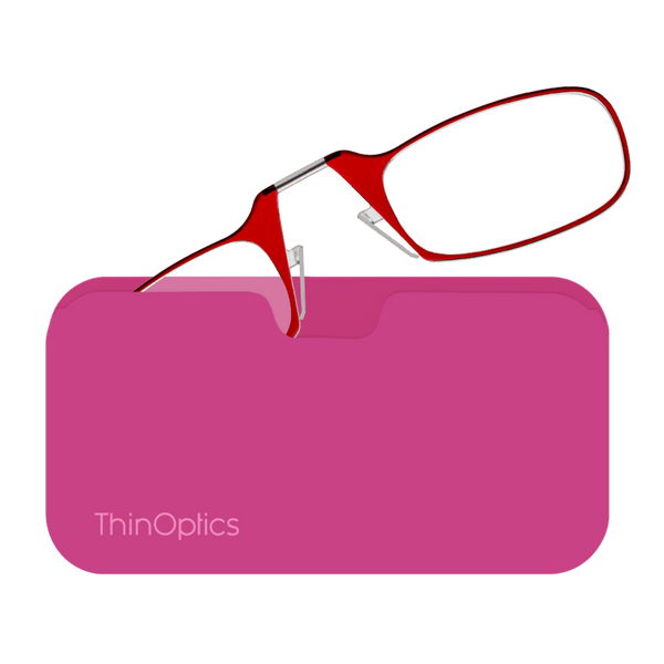 Red ThinOptics reading glasses rest on a pink case, showcasing their slim and portable design.