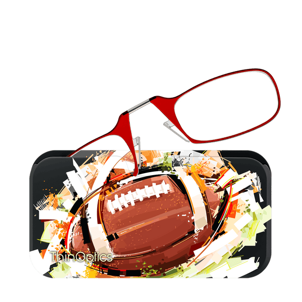 Red reading glasses rest on a black eyeglass case featuring an abstract illustration of a football against a colorful stadium background.