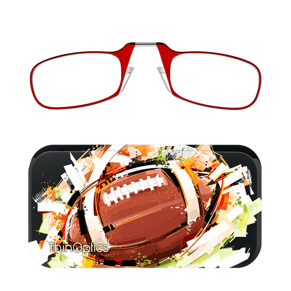 Red ThinOptics reading glasses rest above a matching case featuring a close-up, abstract painting of a football.