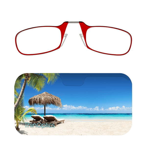Red ThinOptics reading glasses rest on a tropical beach-themed case.