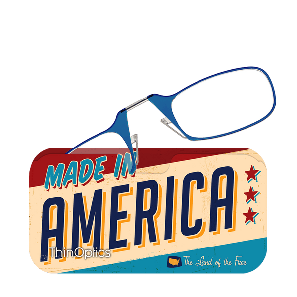 Blue ThinOptics reading glasses rest on a retro-style case proclaiming "Made in America, The Land of the Free."