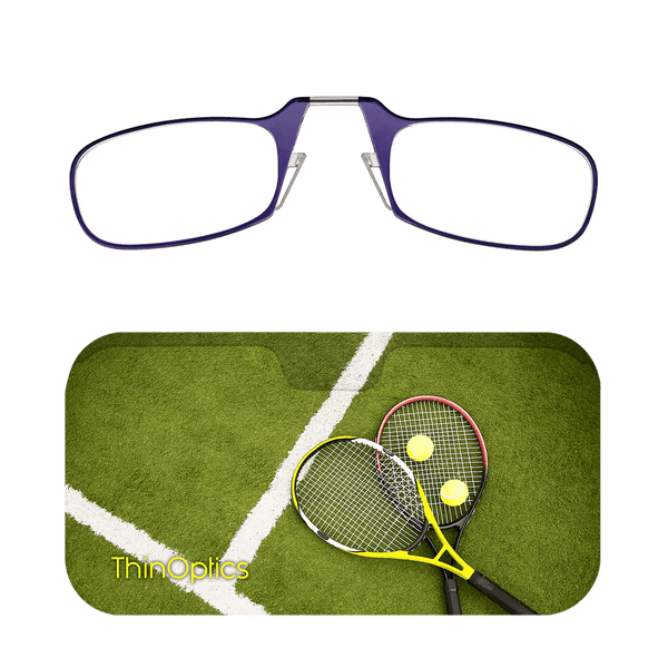 Purple ThinOptics reading glasses rest above a green tennis court case with two rackets and tennis balls.