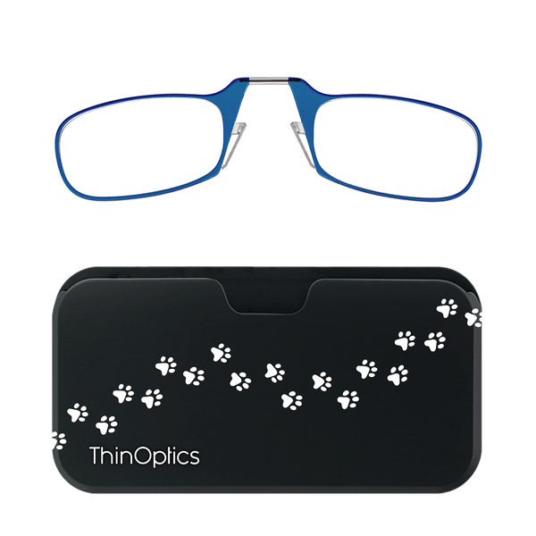 Blue ThinOptics reading glasses rest above their compact black case decorated with white paw prints.