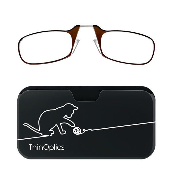 Brown ThinOptics reading glasses folded atop their slim, black case featuring a minimalist cat playing with yarn.