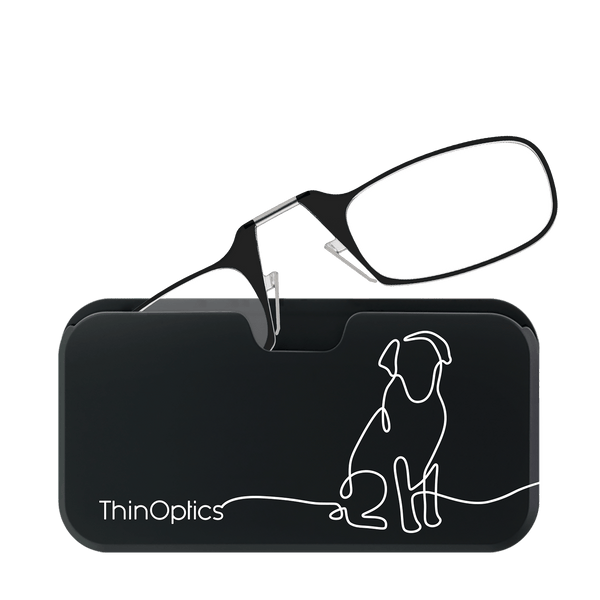 Black ThinOptics reading glasses rest open on top of their matching slim case featuring a minimalist white line drawing of a dog.