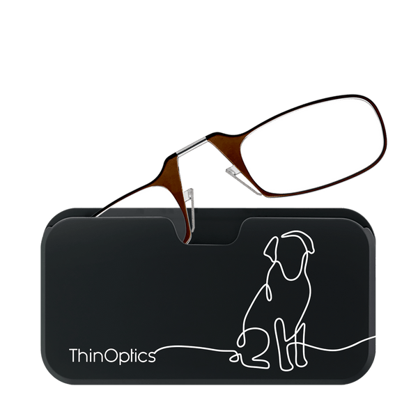 Brown ThinOptics reading glasses rest on a black carrying case featuring a minimalist dog line drawing.
