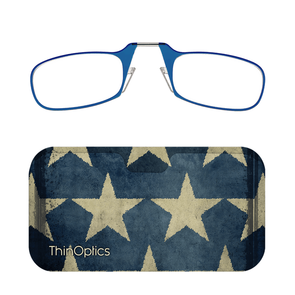 Blue ThinOptics reading glasses folded on top of a navy blue carrying case decorated with distressed, beige stars.