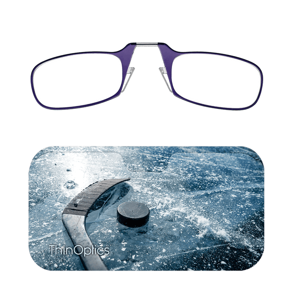Purple ThinOptics reading glasses displayed above an image of a hockey puck and stick on an icy surface.