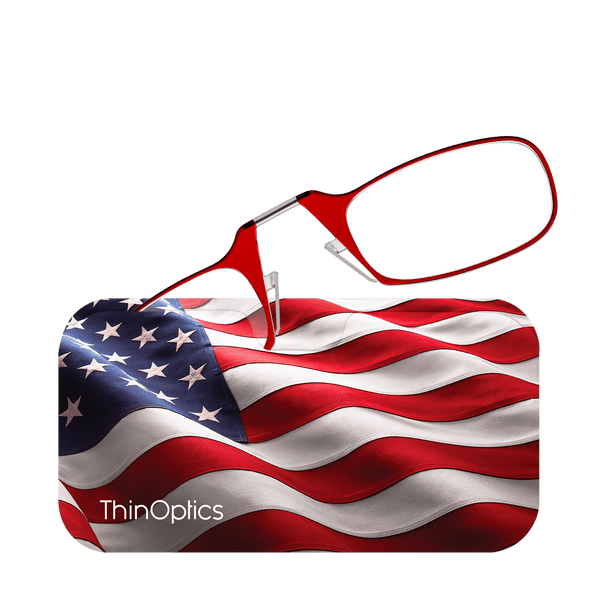 Red ThinOptics reading glasses rest on a case featuring the American flag.