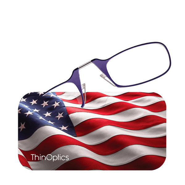 Purple ThinOptics reading glasses rest on a waving American flag.