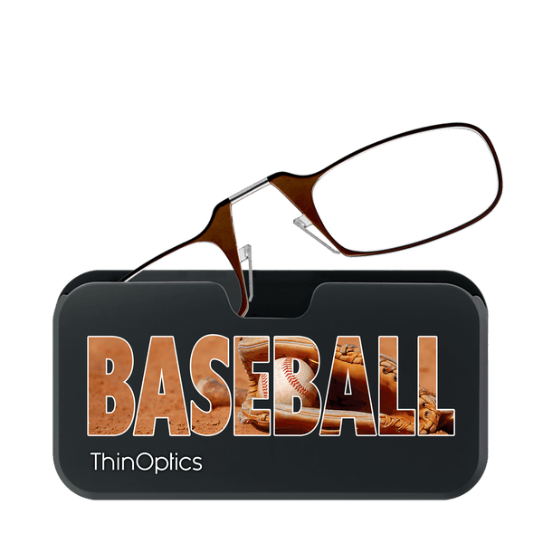 Brown ThinOptics reading glasses rest on a slim black case featuring a baseball glove and the word "BASEBALL" set against a dirt field background.