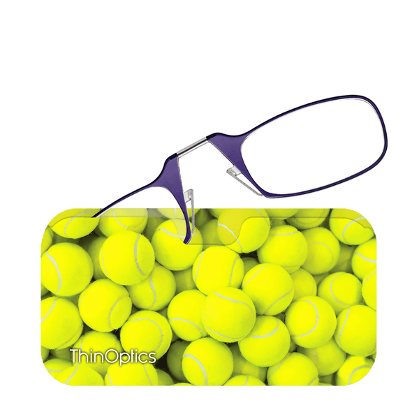 ThinOptics purple reading glasses rest on a case featuring a close-up pattern of bright yellow tennis balls.